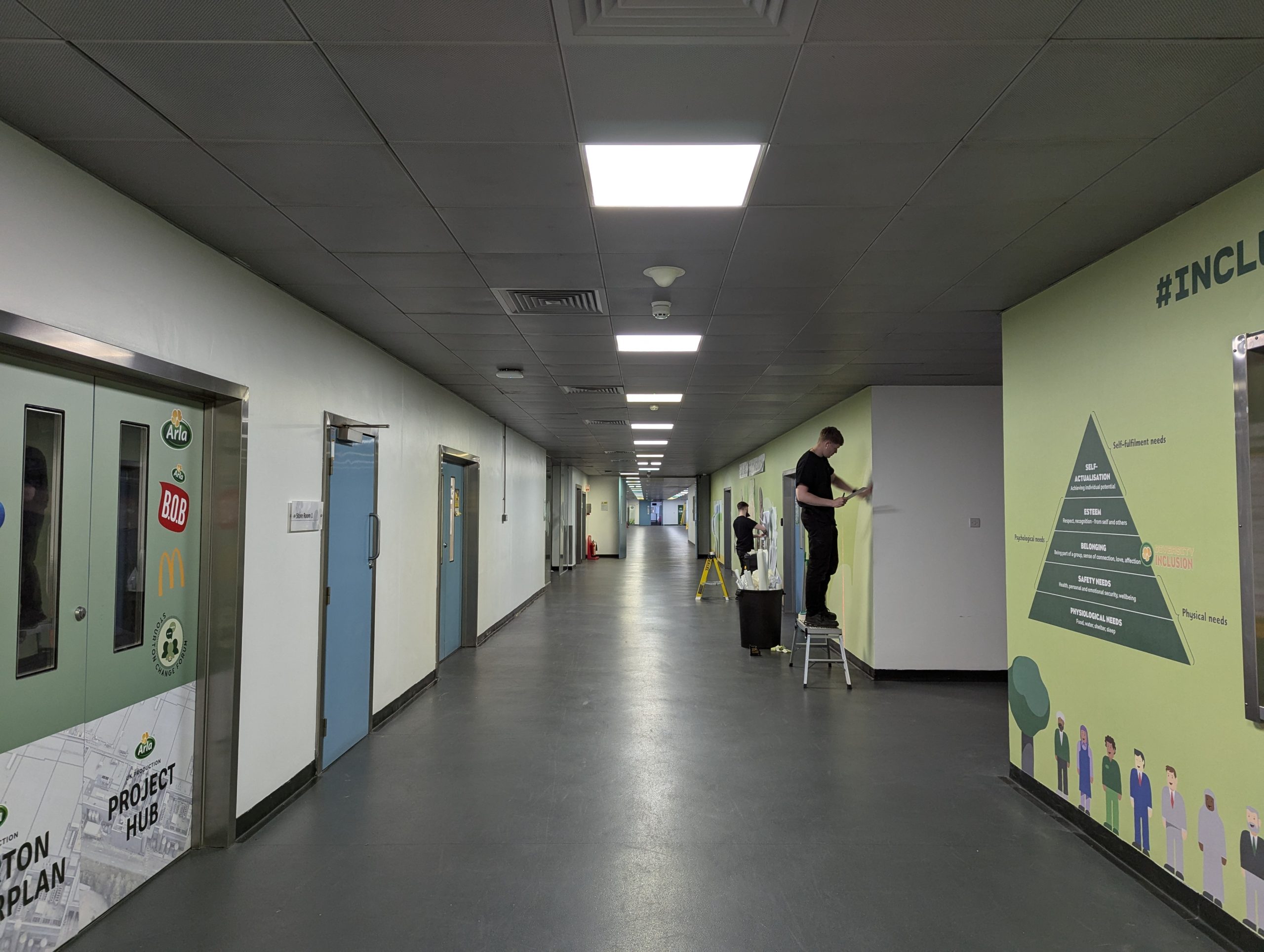 Peak VM applying wall graphics at Arla