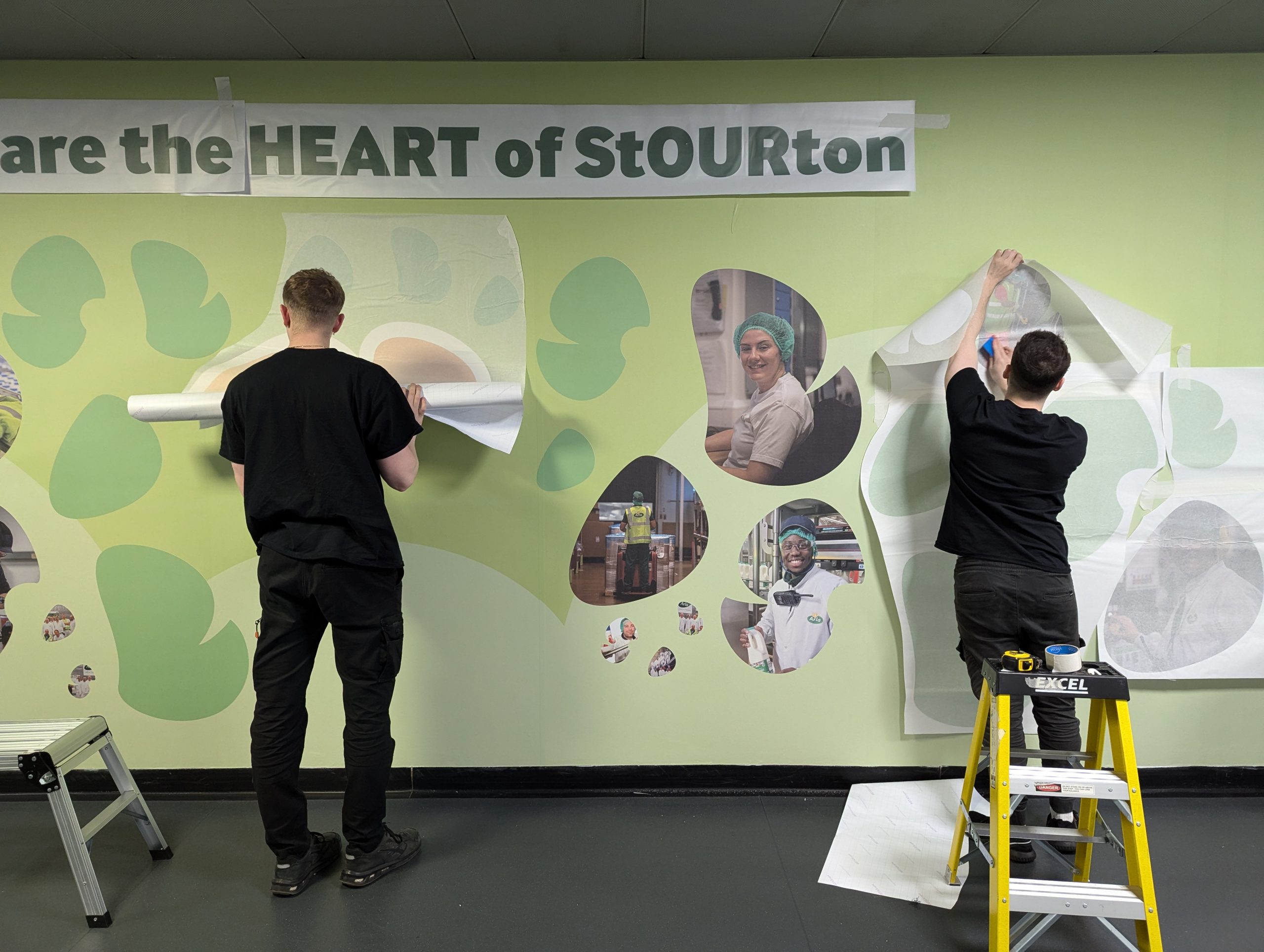 Peak VM applying wall graphics at Arla