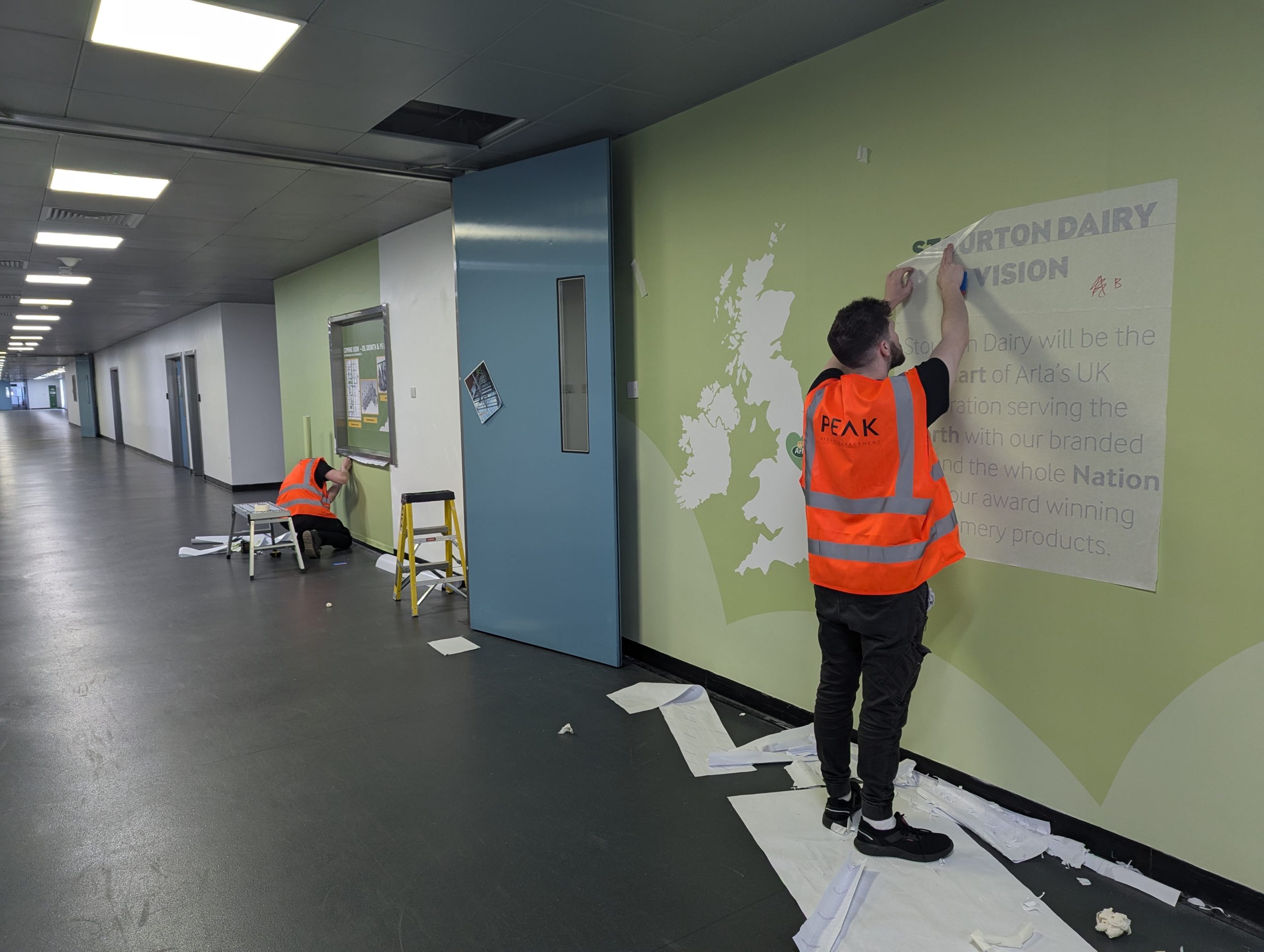 Peak VM applying wall graphics at Arla